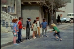 The producers want to make sure we understand that these kids are poor--so poor that Mike's sister Katie is wearing a dress about three sizes too small.