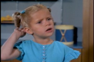 She's attending a tea party later in the day and can't take the risk of mussing her hair.