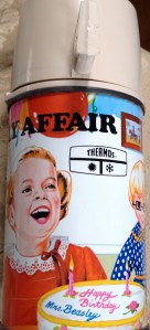 The thermos displays the same scene.