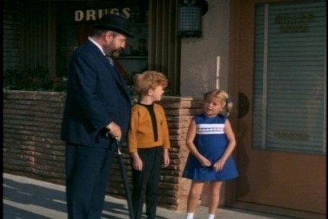 First they stop outside a drug store and remember going there for ice cream with their parents.