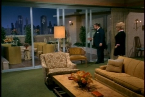 On the night of their date, he gives her a tour of the Davis apartment.