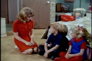 Cissy tells them they all need to go along with Uncle Bill's wishes. (They really must be getting ready to move--the desk has already disappeared from the girls' room.)