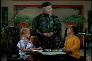 Grandfather is even teaching the twins to write Chinese characters.