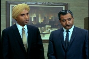 His East Indian associates have an "only in America" moment when they learn that doll hospitals exist.