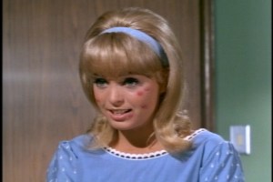 In fact, it looks like someone attacked her face with a bingo dauber.