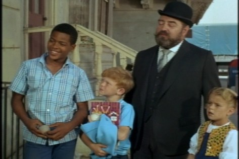 He laughs about her "Chinese chauffeur." He also says "ooo-eee" at one point. Must be a favorite neighborhood expression.