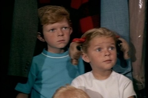 Jody is playing cowboys with some of his friends, and he's using schoolmarm Buffy as a shield. 