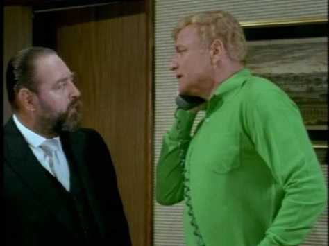 Alerted by his colleague, Bill tells French to tune in "the news program" on the television. 