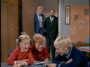 For an agonizingly long time, we listen as he describes his problem--waking up with his beard in "classic disarray." He's looking for something like a woman's hairnet to keep his "hirsute adornments" in order.