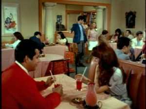 She's excited to see that this youth hangout is just like ones at home.