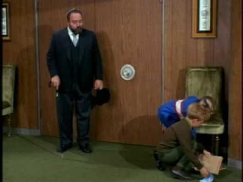 Jody is so excited to show Bill his grades that he drops his books to the floor--an error that French quickly makes him rectify.