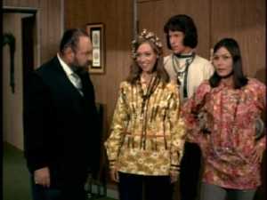 He does take a quick glance toward their feet, however. We know how he feels about proper footwear.